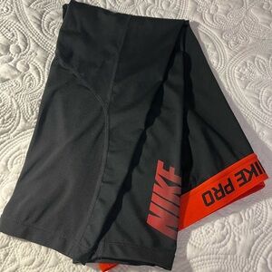 Nike Pro Women’s Dri-Fit, Capri Leggings, Black with Red Logo, Size Medium